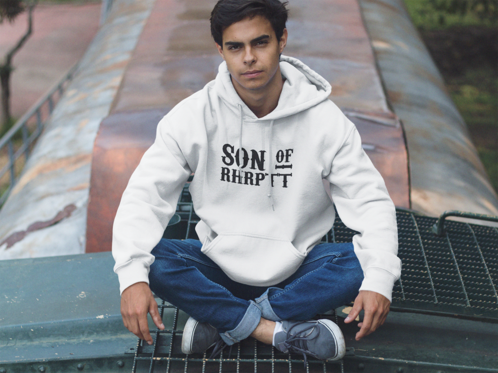 young man sitting cross legged on a train pullover hoodie mockup a12497 2 RHRPTT heisst Ruhrpott